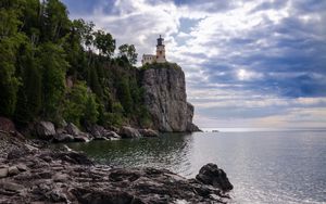 Preview wallpaper lighthouse, sea, cliff, rock, shore