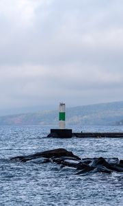 Preview wallpaper lighthouse, sea, coast, stones, waves