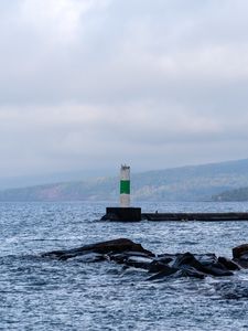 Preview wallpaper lighthouse, sea, coast, stones, waves