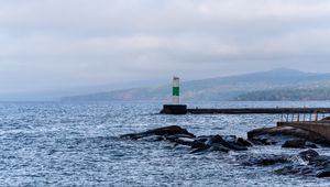Preview wallpaper lighthouse, sea, coast, stones, waves