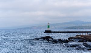 Preview wallpaper lighthouse, sea, coast, stones, waves
