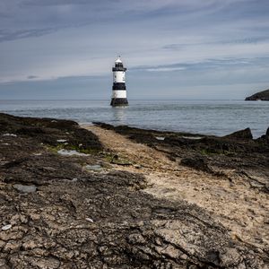 Preview wallpaper lighthouse, sea, coast, sky