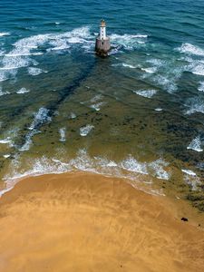 Preview wallpaper lighthouse, sea, foam, waves, shore, bottom