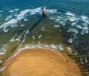 Preview wallpaper lighthouse, sea, foam, waves, shore, bottom