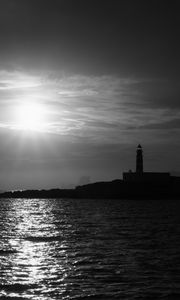 Preview wallpaper lighthouse, sea, glare, rays, dark
