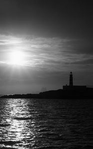 Preview wallpaper lighthouse, sea, glare, rays, dark