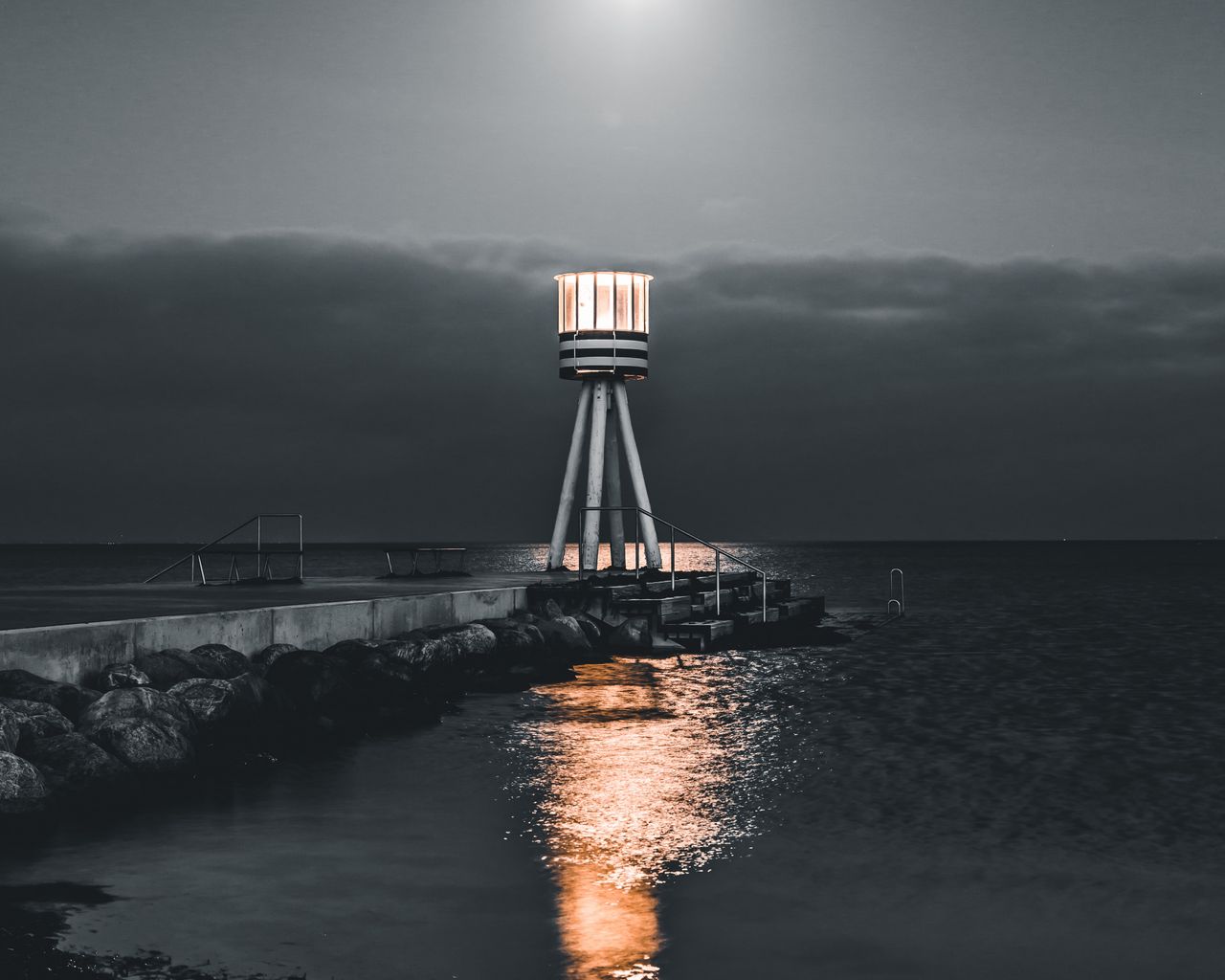 Download wallpaper 1280x1024 lighthouse, sea, pier, night, stones, water  standard 5:4 hd background