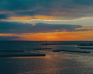 Preview wallpaper lighthouse, sea, pier, horizon, sunset