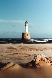 Preview wallpaper lighthouse, sea, sand, surf, waves, horizon