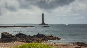 Preview wallpaper lighthouse, sea, shore, bush, stones