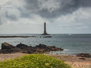 Preview wallpaper lighthouse, sea, shore, bush, stones