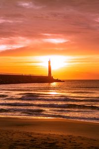 Preview wallpaper lighthouse, sea, sunset, dusk, coast