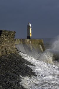 Preview wallpaper lighthouse, sea, waves, splashes, fortress, slope, nature