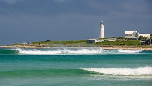Preview wallpaper lighthouse, sea, waves, buildings