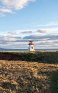 Preview wallpaper lighthouse, shore, grass, sky, sea