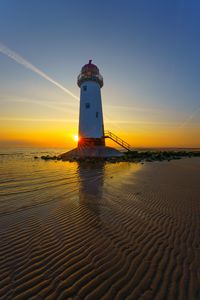 Preview wallpaper lighthouse, shore, sea, sand, sunrise