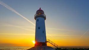 Preview wallpaper lighthouse, shore, sea, sand, sunrise