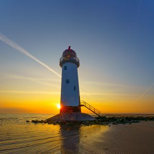 Preview wallpaper lighthouse, shore, sea, sand, sunrise