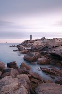 Preview wallpaper lighthouse, stones, sea, rocks