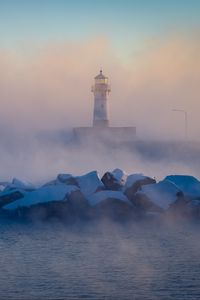 Preview wallpaper lighthouse, stones, sea, fog