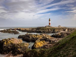 Preview wallpaper lighthouse, stones, sea, sky, nature