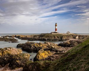 Preview wallpaper lighthouse, stones, sea, sky, nature