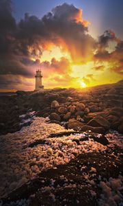 Preview wallpaper lighthouse, stones, shore, clouds