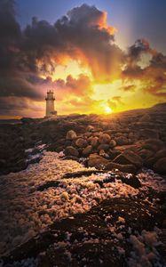 Preview wallpaper lighthouse, stones, shore, clouds