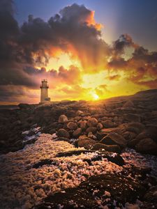 Preview wallpaper lighthouse, stones, shore, clouds