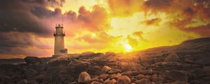 Preview wallpaper lighthouse, stones, shore, clouds