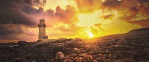 Preview wallpaper lighthouse, stones, shore, clouds