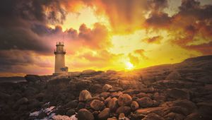 Preview wallpaper lighthouse, stones, shore, clouds