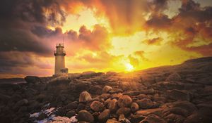 Preview wallpaper lighthouse, stones, shore, clouds