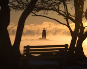 Preview wallpaper lighthouse, sunset, bench, blur, trees, branches