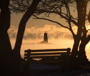 Preview wallpaper lighthouse, sunset, bench, blur, trees, branches