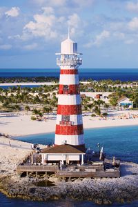 Preview wallpaper lighthouse, tower, beach, island, sea, landscape