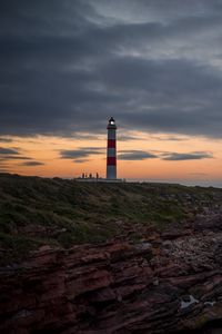 Preview wallpaper lighthouse, tower, cliff, twilight