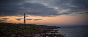 Preview wallpaper lighthouse, tower, cliff, twilight