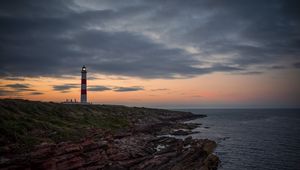 Preview wallpaper lighthouse, tower, cliff, twilight