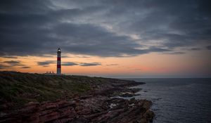 Preview wallpaper lighthouse, tower, cliff, twilight