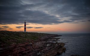 Preview wallpaper lighthouse, tower, cliff, twilight
