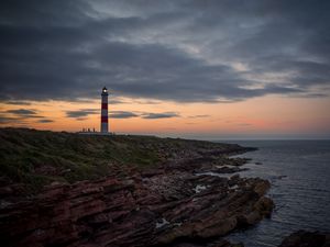 Preview wallpaper lighthouse, tower, cliff, twilight