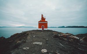 Preview wallpaper lighthouse, tower, coast, rocks, stones