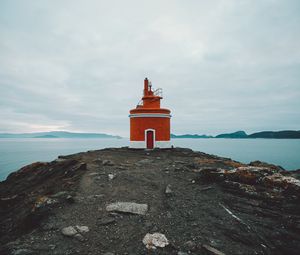 Preview wallpaper lighthouse, tower, coast, rocks, stones