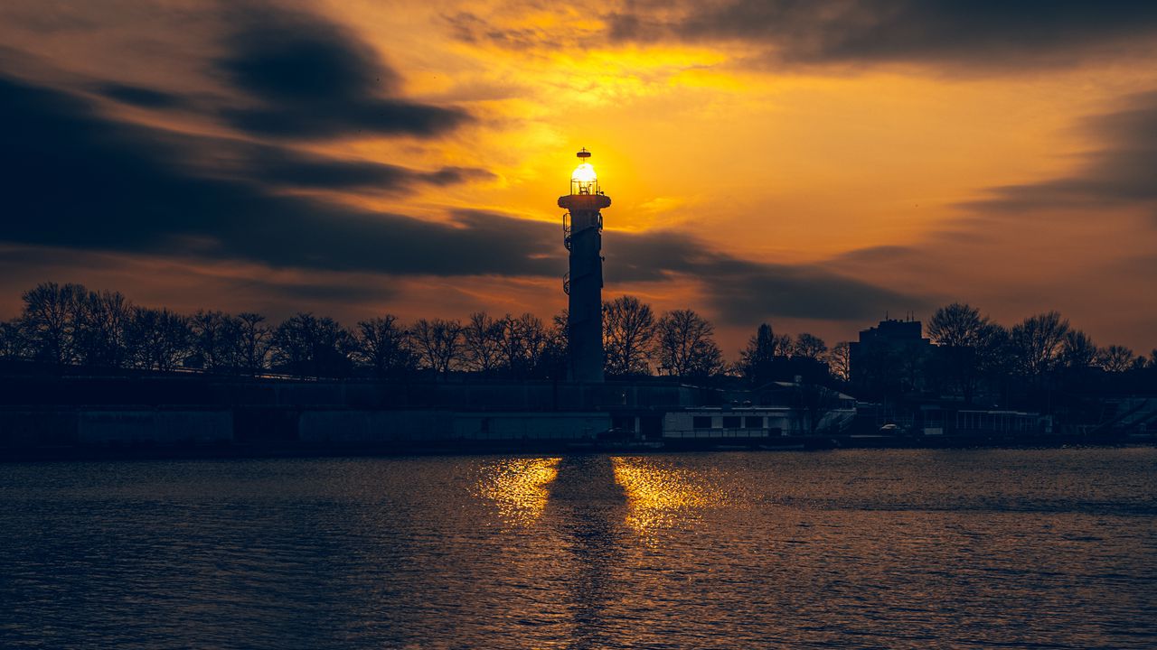 Wallpaper lighthouse, tower, light, water, trees, twilight, dark