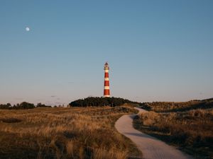 Preview wallpaper lighthouse, tower, road, grass, landscape