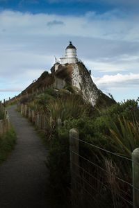 Preview wallpaper lighthouse, tower, road, hill, landscape