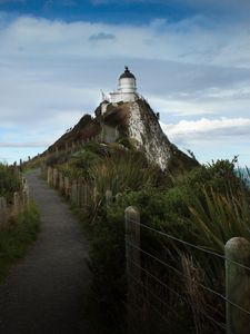 Preview wallpaper lighthouse, tower, road, hill, landscape