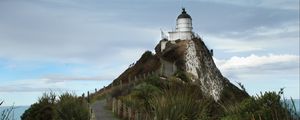 Preview wallpaper lighthouse, tower, road, hill, landscape