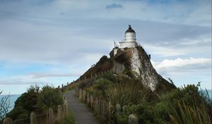 Preview wallpaper lighthouse, tower, road, hill, landscape